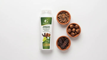 Amretha shampoo with bowls of dried amla, reetha soapnuts and shikakai pods
